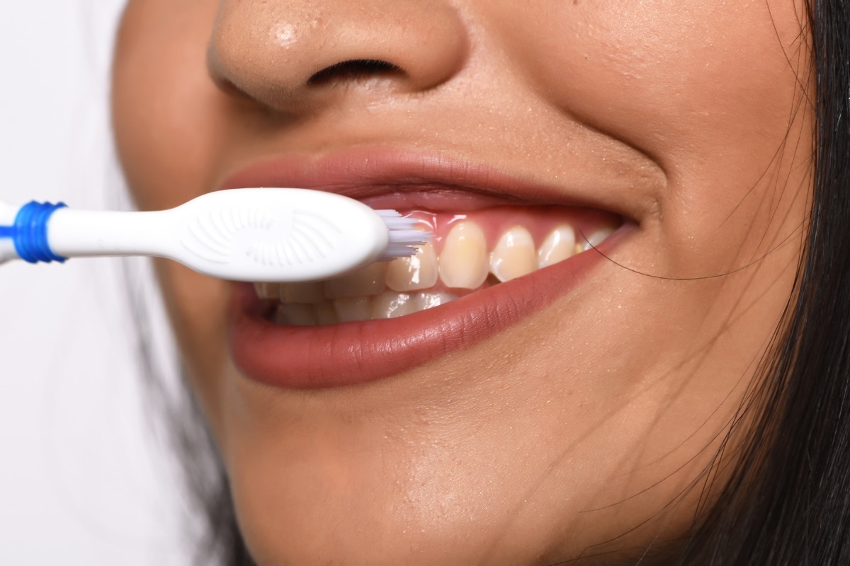 why do my gums bleed when I brush